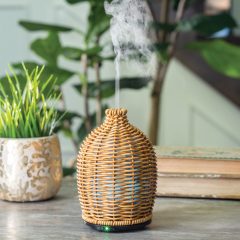 The Wicker Vase Medium Diffuser has a matte wicker that is tightly woven into a beautiful sleeve, giving off a subtle glow when in use. This diffuser brings a natural warmth to your space with organic, earthy textures and neutral tones.