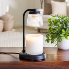 Add a touch of elegance to your home with our Fluted Glass Candle Warmer Lamp. The clear glass shade allows light and warmth to shine through freely, while the glass flutes create a beautiful decorative effect. Our candle warmer lamps use top-down warming technology that lets you enjoy the scent and ambiance of a candle without a flame.