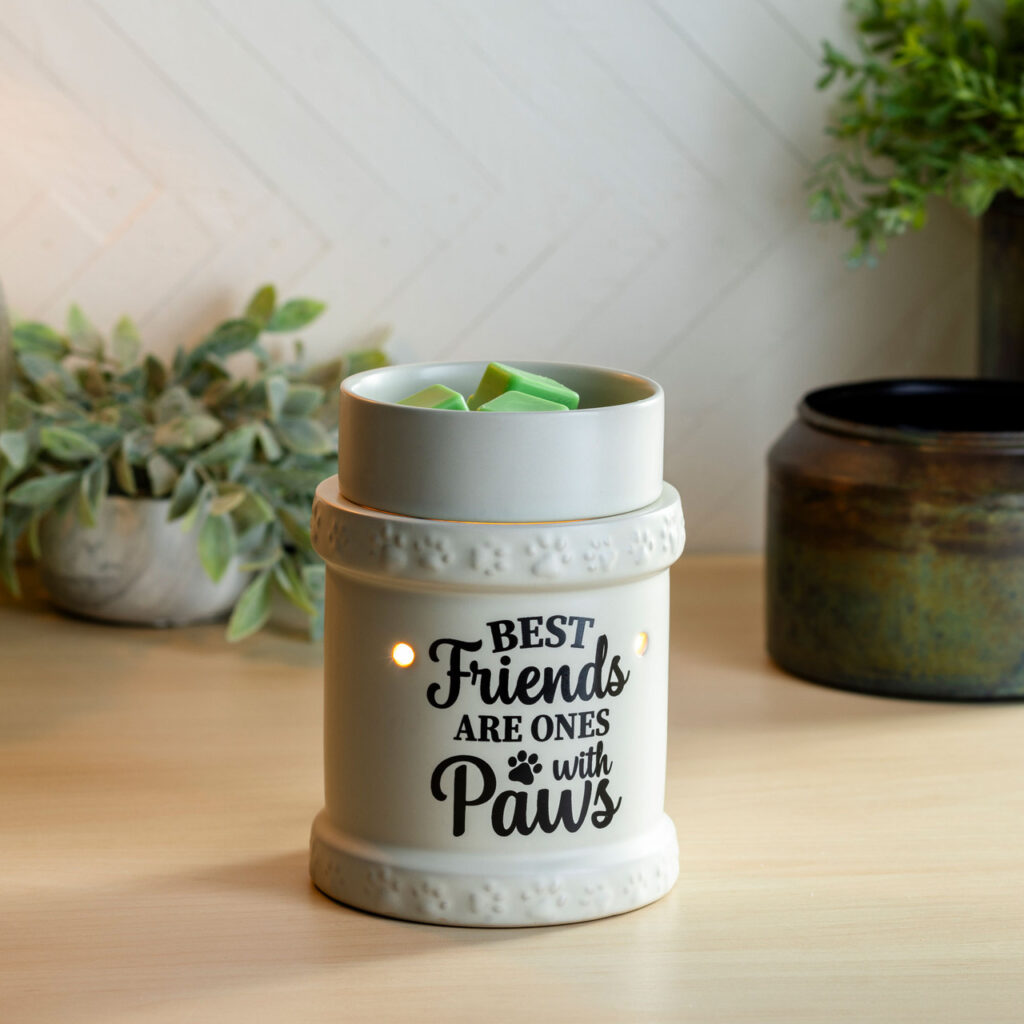 Indulge yourself in the delightful ambiance of the Best Friends Illumination Fragrance Warmer. The black lettering "Best Friend are Ones with Paws" on a cream warmer and adorable paw print details, is sure to remind you of your furry friends and their love and loyalty.