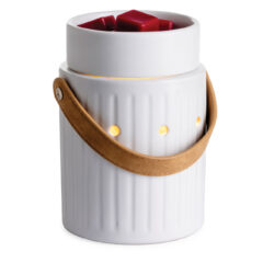 The Leather Handle Illumination Fragrance Warmer is a simple design that is both modern and classic. This fragrance warmer is crafted from the finest materials, and is the safest way to enjoy fragrance at home. A vertical design element gives the warmer a classic feel, while the white glaze showcases antique charm.
