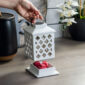 Add a touch of elegance to your home with the Trellis Lantern Canopy Illumination Warmer. Inspired by on-trend trellis patterns, this elegant warmer features a metal handle and is accented with a halogen bulb that warms wax melts in the warming dish to fill large areas with fragrance.