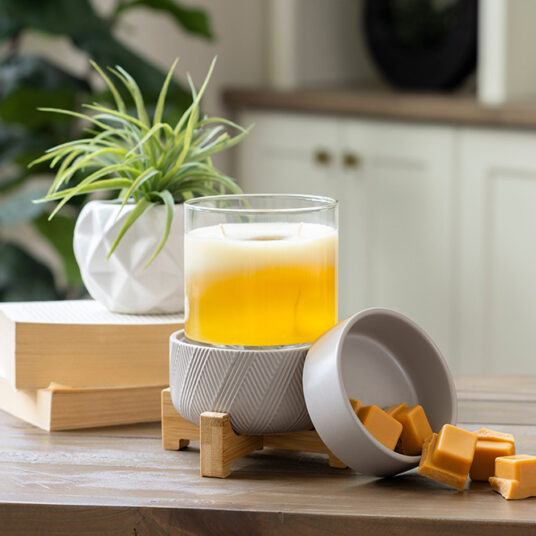 DESIGN: Enjoy the simple yet stunning functionality of the Wooden Pedestal 2-in-1 Fragrance Warmer with a low-key design. The curved wooden stand and grey ceramic finish will transform your living space into a relaxing oasis with the aroma of your favorite candles or wax melts.
FEATURES: Removable dish for use with your favorite fragrance wax melts, bricks or tarts. Easy on/off dial on cord and an indicator light so you know when it is on.
USE: For use with candles that are 10 oz or smaller or wax fragrance melts or wax tarts.
SPECS: Warming plate is 3.9