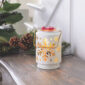 Glow away, winter blues! Our vintage Snowflake Illumination Fragrance Warmer will fill your home with fine fragrance and an enchanting ambiance. The vintage tin can styling was designed as a nod to holiday memories, and paired with soft illumination to transform any space into a winter wonderland.