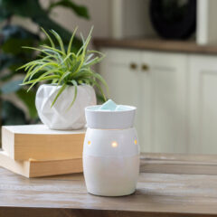 DESIGN: Add a dreamy glow to any space with the Iridescent Midsize Illumination Fragrance Warmer the perfect way to fill your home with delicious scents and soft, romantic lighting. This modern and chic warmer features a pearlescent pink and white exterior that illuminates from within, melting wax in the dish on top and surrounding you in fragrance.
FEATURES: Smaller fragrance warmer for small and medium rooms with a removable wax dish for easy wax removal.
USE: Warms fragrance melts and tarts. Roller switch for easy on/off is on the cord. Cord is 3ft long. NP7 bulb (included) can be changed out when bulb wears out.
SPECS: Overall dimensions are 5