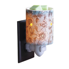 Give your home a breath of fresh air with the Flora Pluggable Fragrance Warmer. The powdered robin's egg blue and vintage floral print of this ceramic wax warmer will uplift your spirit and infuse your home with fragrance of your choice. This bohemian-inspired warmer makes a thoughtful gift for the free-spirited.