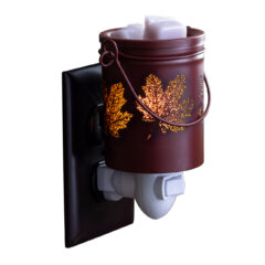 Welcome autumn home with the Fall Leaves Pluggable Fragrance Warmer. The detail on this vessel brings gorgeous fall style to any room with its deep maroon color and cutouts shaped like drifting leaves. Just plug it in and let the dish gently melt wax melts to infuse your space with seasonal scents. As the bulb warms your faborite wax metls, enjoy the beautiful glow reminiscent of cozy sweaters and crisp fall days.