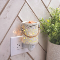 Create a rustic ambiance in any room with the Lone Star Pluggable Fragrance Warmer. The light from the interior of the warmer creates a beautiful stargazing effect that dances across the walls and ceiling. It's perfect for filling your home with a lovely fragrance and bringing a vintage or farmhouse vibe to your decor. The removable dish makes switching wax melts a breeze, so you can change your scents with the season.