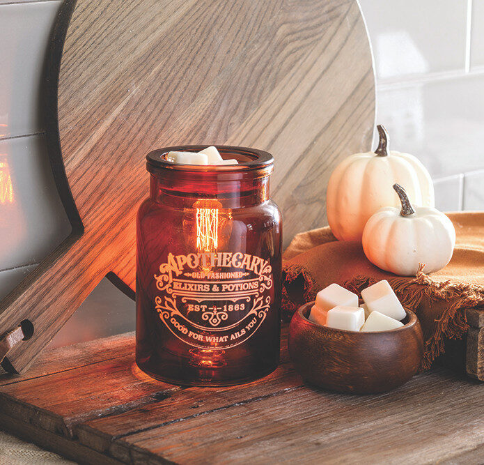 The Apothecary Illumination Fragrance warmer will allure you with amber-colored glass and an Edison style bulb from within. The enchanting dark academia glow that fills the room will set the vibe for a relaxing night at home while bringing any style of decor to life. Melt your favorite home fragrance in the dish on top of the vessel, which resembles an old fashioned medicine jar.