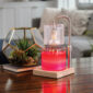 Add a touch of elegance to your home with our Silver Hobnail Glass Candle Warmer Lamp. The clear glass shade allows light and warmth to shine through freely, while the glass flutes create a beautiful decorative effect. Our candle warmer lamps use top-down warming technology that lets you enjoy the scent and ambiance of a candle without a flame. Features an adustable stem and timer/dimmer switch.
