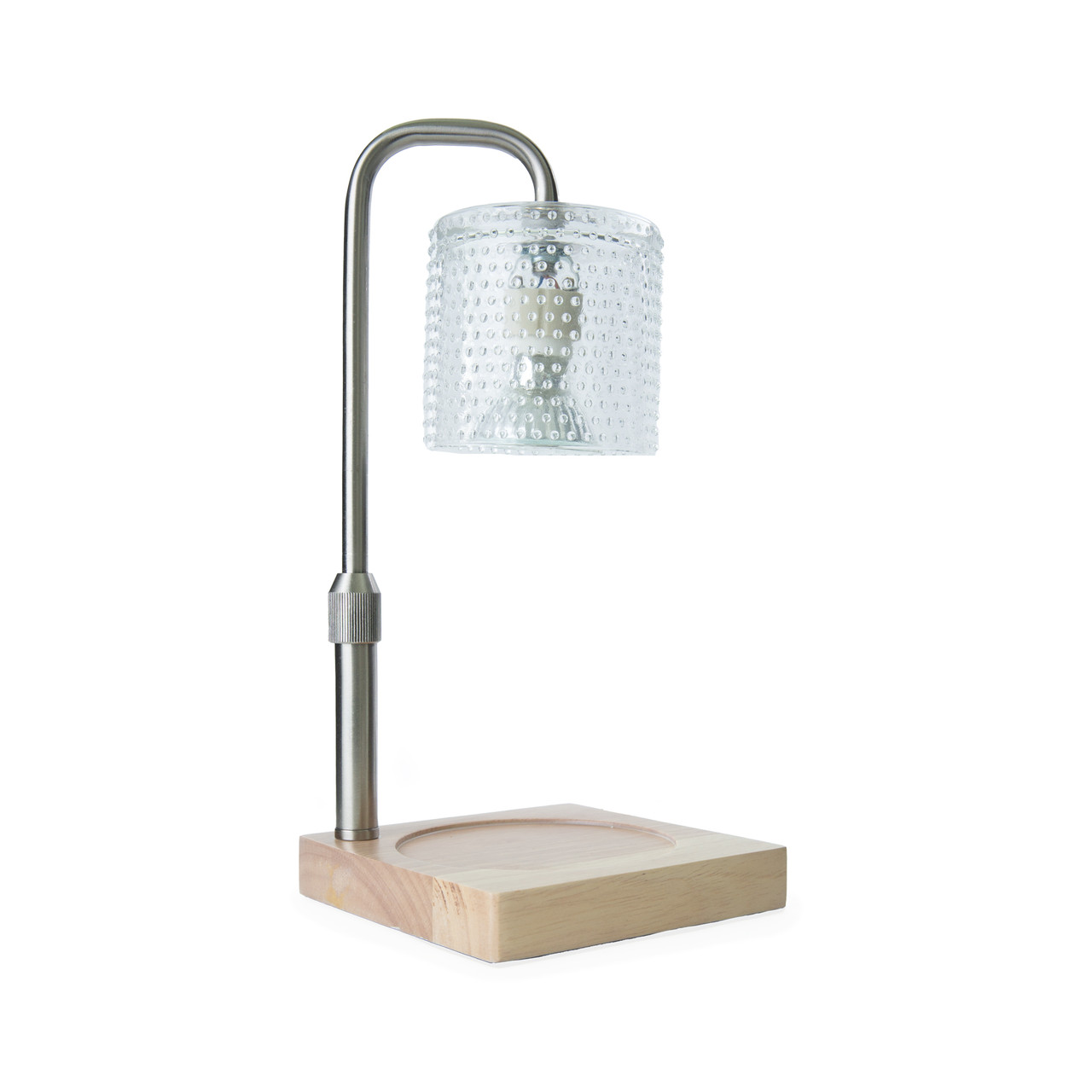 Add a touch of elegance to your home with our Silver Hobnail Glass Candle Warmer Lamp. The clear glass shade allows light and warmth to shine through freely, while the glass flutes create a beautiful decorative effect. Our candle warmer lamps use top-down warming technology that lets you enjoy the scent and ambiance of a candle without a flame. Features an adustable stem and timer/dimmer switch.