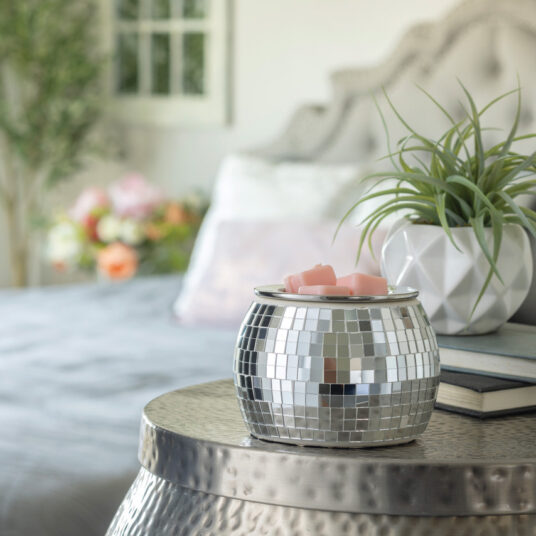 Step back into the disco era with the Art Scents Disco Ball Fragrance Warmer. Shaped like a classic disco ball, this fragrance warmer brings a touch of groovy flair to any room, making it the perfect accessory for those who love a bit of 70's charm and funky style.