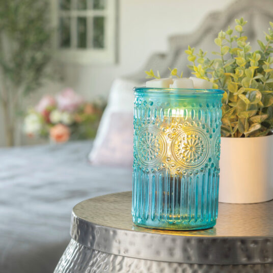 Elevate your home decor with the Vintage Parisian Glass Fragrance Warmer. This exquisite piece combines the timeless beauty of embossed tinted glass with the functionality of a fragrance warmer, making it a standout addition to any room. Featuring intricate floral motifs surrounded by delicate beading, this fragrance warmer is designed to provide both textural and visual appeal, creating a sophisticated and inviting atmosphere.