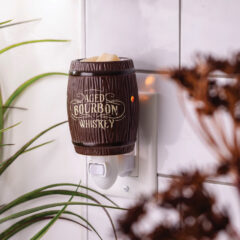 Elevate your home’s ambiance with the Pluggable Bourbon Barrel Fragrance Warmer. This distinctive piece combines vintage western style with modern functionality, making it a standout addition to any room. Expertly crafted to resemble a traditional wooden bourbon barrel, this pluggable fragrance warmer boasts intricate details and a realistic wood grain finish. The