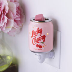 Sweeten your space with a touch of nostalgia with the Lucky Cherry Pluggable Fragrance Warmer, a delightful blend of vintage charm and modern functionality. Reminiscent of old-fashioned soda shops, the Lucky Cherry Pluggable Fragrance Warmer features a beautifully detailed pink soda bottle design. The vibrant red