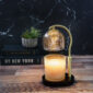 Elevate your home decor with the Mercury Glass Candle Warmer Lamp. With its gold mercury glass shade, elegant adjustable gold stem, and sleek black base, it brings timeless sophistication to any room. Its top-down warming technology safely melts candles flame free for even, long lasting fragrance release, making it a stylish, functional statement piece.