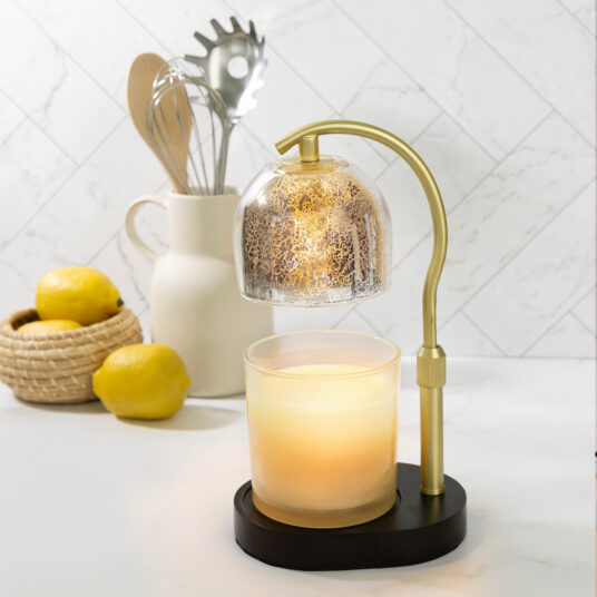 Elevate your home decor with the Mercury Glass Candle Warmer Lamp. With its gold mercury glass shade, elegant adjustable gold stem, and sleek black base, it brings timeless sophistication to any room. Its top-down warming technology safely melts candles flame free for even, long lasting fragrance release, making it a stylish, functional statement piece.