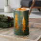 Bring the serene beauty of nature indoors with our Golden Pines Illumination Wax Warmer. Glowing pine tree cutouts cast soft patterns, while a vintage bulb adds a warm golden light. The green distressed metal finish offers rustic charm, blending nature-inspired design with cozy, vintage appeal.