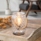 The Art Glass Lamp Vintage Illumination Warmer blends midcentury charm with timeless elegance. Its all-glass design features a white and clear pattern that glows softly orange when lit. With a vintage bulb and glass wax tray, it offers a flame-free way to enjoy fragrance while adding a stylish touch to any room.