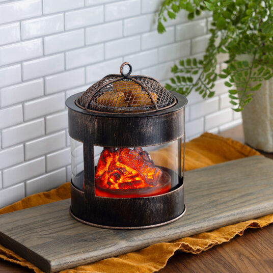 The Fire Pit Wax Warmer brings the cozy ambiance of a crackling fire into your home. The design mimics a rustic fire pit, featuring a mesh lid and the comforting glow of smoldering embers. Enjoy the essence of the outdoors year-round while filling your space with your favorite scents.