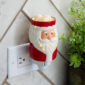 The St. Nick Pluggable Fragrance Warmer channels festive joy. This cheerful warmer features jolly old St. Nick, clad in his classic red outfit and snowy white beard. Perfect for adding a soft glow to small spaces, simply plug in to any outlet to gently warm your favorite holiday scents. Add Santa’s charm, warmth, and merriment to your home!
