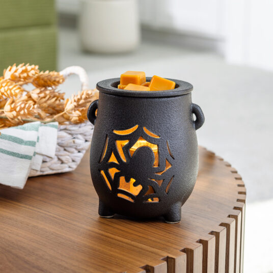 The Creepy Cauldron Fragrance Warmer brings a spooky-charming touch to your Halloween décor. The textured black cauldron features a spider and web cutout design that sets an eerie mood while melting your favorite scents. Perfect for filling your home with festive, ghoulish fragrance all season long.