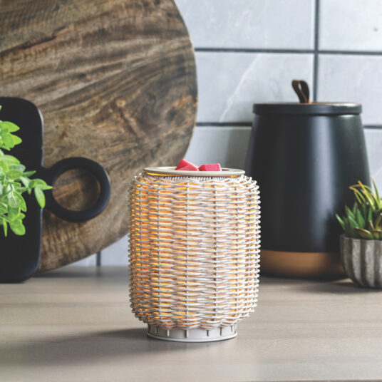 Bring natural texture and soft lighting into your home with the Grey Wicker Illumination Warmer. This decorative electric wax warmer features a rustic gray wicker design that softly glows from within, adding earthy, organic charm to any space. The woven pattern and neutral tones make it a versatile addition to farmhouse, boho, or coastal décor styles.