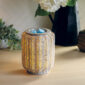 Bring natural texture and soft lighting into your home with the Grey Wicker Illumination Warmer. This decorative electric wax warmer features a rustic gray wicker design that softly glows from within, adding earthy, organic charm to any space. The woven pattern and neutral tones make it a versatile addition to farmhouse, boho, or coastal décor styles.