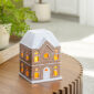 The Gingerbread House Fragrance Warmer adds holiday charm with its classic gingerbread design and cozy canopy glow. Using top-down warming technology, it gently releases seasonal scents without a flame. The perfect festive décor, it fills your home with warmth, inviting aromas, and whimsical holiday spirit.
