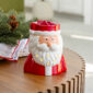 Welcome the holiday spirit with our St. Nick Fragrance Warmer, featuring a jolly Santa in his classic red suit and fluffy white beard. This cheerful warmer emits a warm, cozy glow when lit, adding festive charm to your décor—perfect for holiday gatherings or relaxing evenings by the fire.