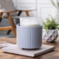 The Fluted Crock Candle Warmer’s matte slate-blue glaze and elegant fluted texture bring modern refinement to any space while offering safe, flameless fragrance.