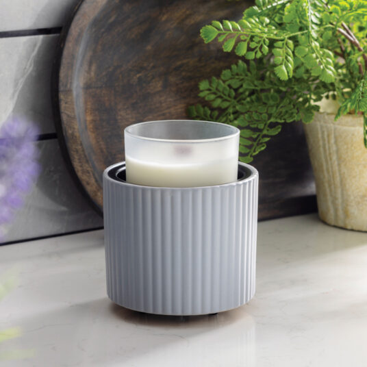 The Fluted Crock Candle Warmer’s matte slate-blue glaze and elegant fluted texture bring modern refinement to any space while offering safe, flameless fragrance.