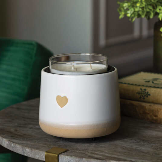 Add handcrafted charm with the I ❤ U Crock Warmer. This crock is covered in a matte white glaze with a heart-shaped detail that reveals natural speckled clay for a tactile, cozy feel.