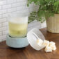 Bring coastal elegance to your space with the Beach Glass 2-in-1 Warmer, showcasing a flecked aqua sea glass base and a removable frosted dish for easy cleaning.