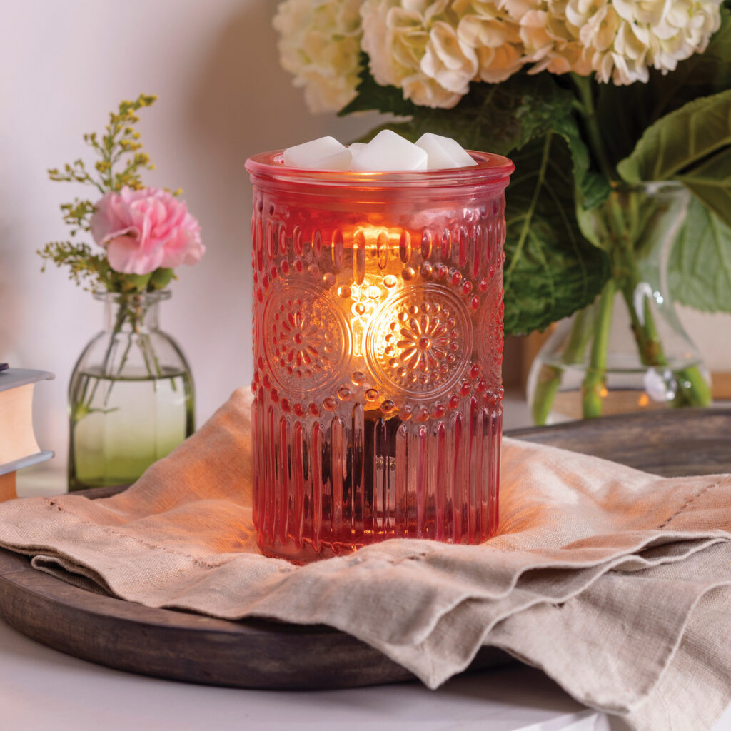 Elevate your home decor with the Pink Parisian Glass Vintage Bulb Fragrance Warmer. This stunning piece combines embossed glass, floral motifs, and delicate beading for romantic, vintage-inspired style.
