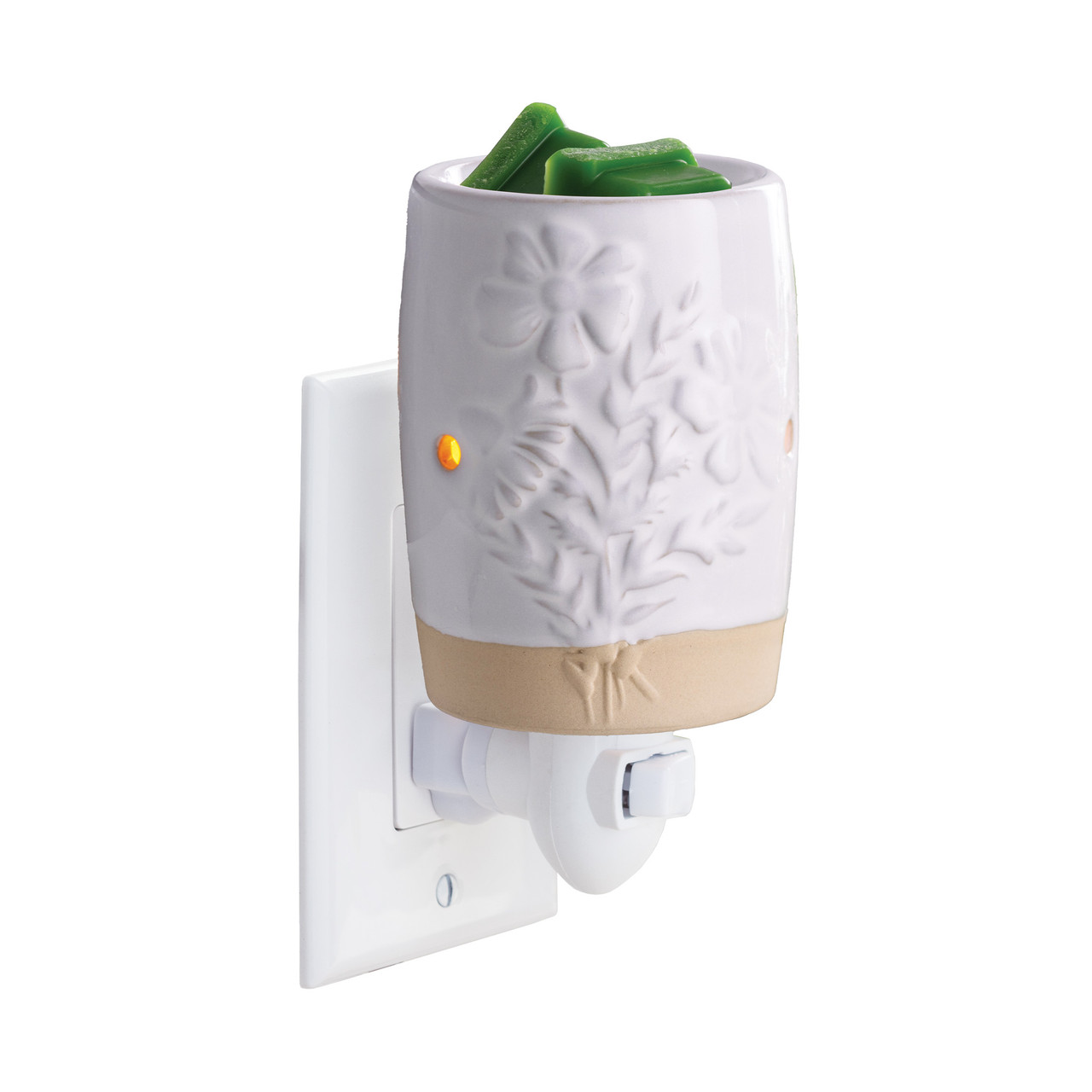 Garden Blooms Pluggable Warmer features delicate embossed floral patterns in a soft neutral palette to bring botanical charm while warming wax melts safely.