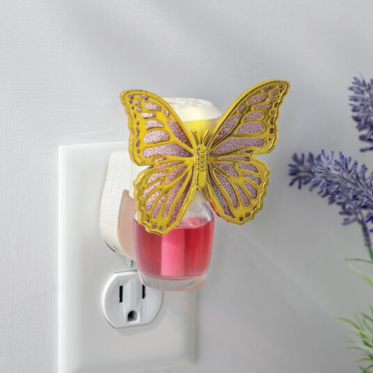 Delicate lavender wings edged in gold give the Butterfly WallScents™ Warmer a whimsical, graceful touch.