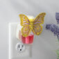 Delicate lavender wings edged in gold give the Butterfly WallScents™ Warmer a whimsical, graceful touch.