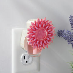 With its vibrant pink petals, the Dahlia WallScents™ Warmer brings a burst of floral charm to any room.