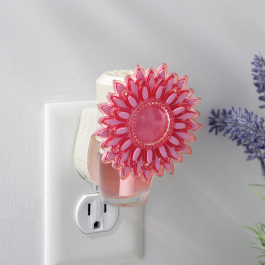 With its vibrant pink petals, the Dahlia WallScents™ Warmer brings a burst of floral charm to any room.