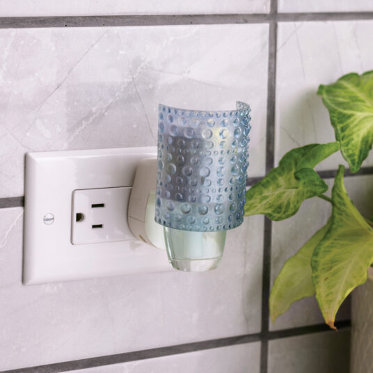 The Hobnail WallScents™ Warmer features a vintage-inspired textured translucent surface in soft blue, casting a cozy glow while gently warming oil for long-lasting fragrance