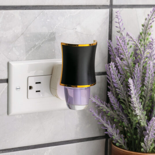 The Hourglass WallScents™ Warmer features a sleek black silhouette with gold accents, adding a touch of luxury to any room.