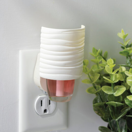 With its smooth, wave-textured design in soft matte white, the Harmony WallScents™ Warmer adds understated elegance to any room.