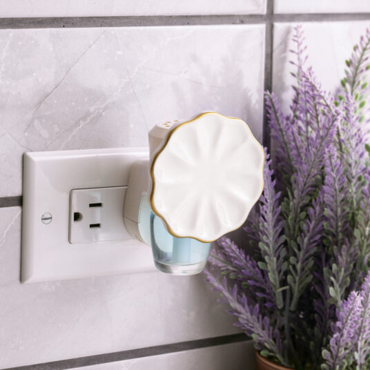 The Scalloped WallScents™ Fragrance Warmer features graceful curves, gold trim, and a soft arched design—elegant and timeless while gently delivering clean, consistent fragrance.