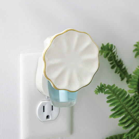 The Scalloped WallScents™ Fragrance Warmer features graceful curves, gold trim, and a soft arched design—elegant and timeless while gently delivering clean, consistent fragrance.