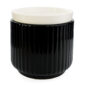 Glossy black ribbed ceramic meets a crisp white removable dish in the Noir Wax Warmer for a striking, modern silhouette that elevates contemporary decor.