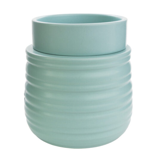 The Ruche Wax Warmer features a softly ribbed texture and light teal glaze to add subtle, modern charm to your home.