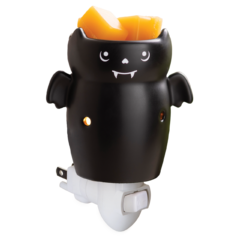 Black bat-shaped plug-in wax warmer holding orange wax